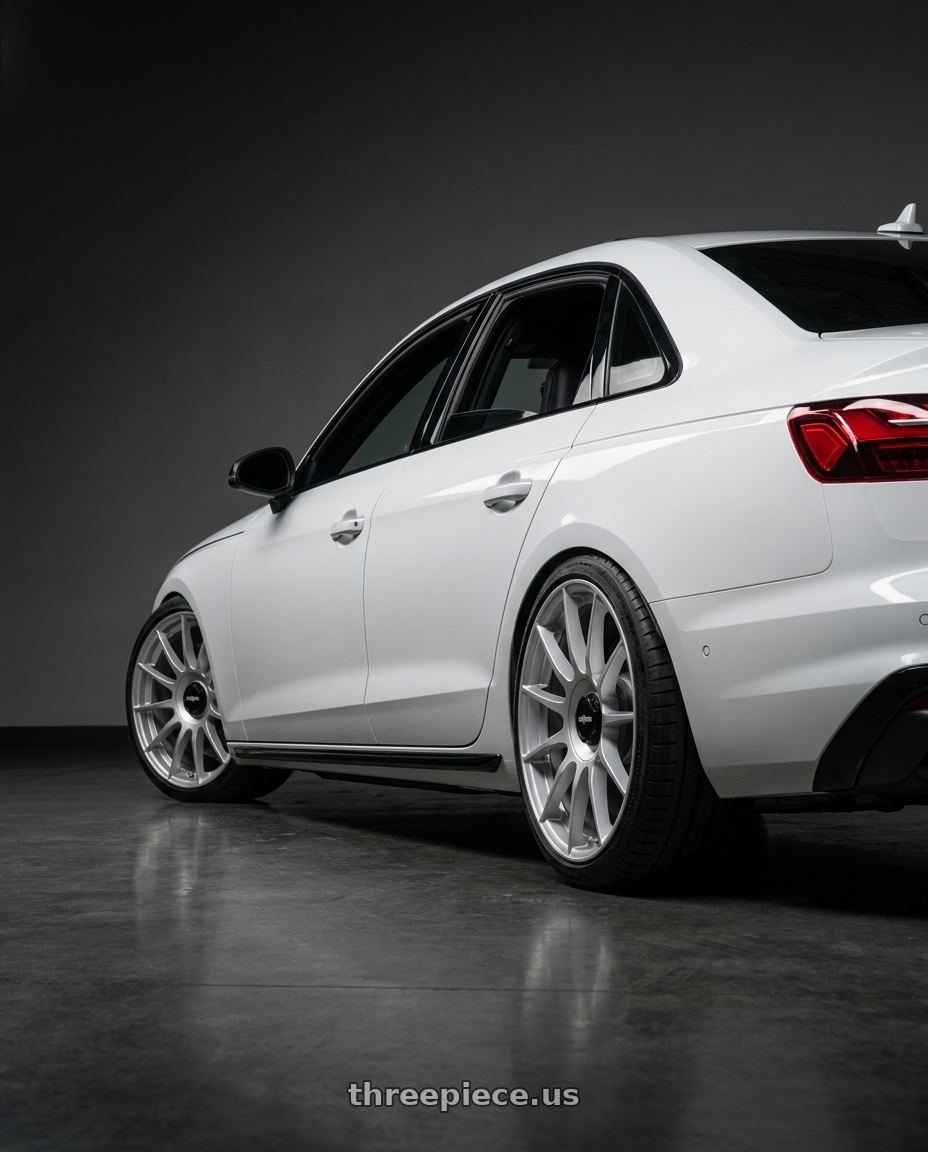 2020 Audi S4 with Rotiform DTM 6x120 20x8.5 +45 Silver wheels rear three quarter view square tires