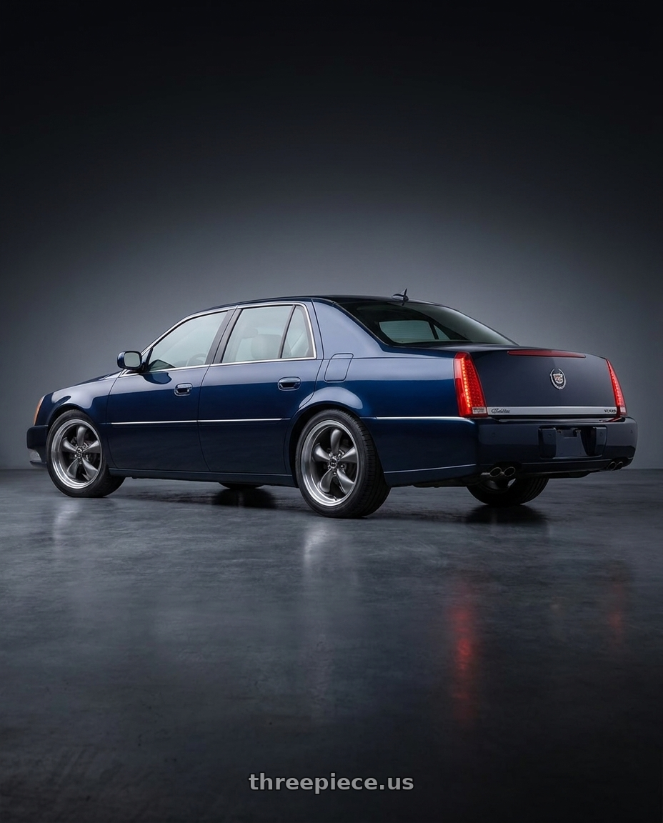 2005 Cadillac deville with American Racing AR105 TORQ THRUST M 5X115 16X7 +35 ANTHRACITE W/ MACHINED LIP wheels rear three quarter view square tires