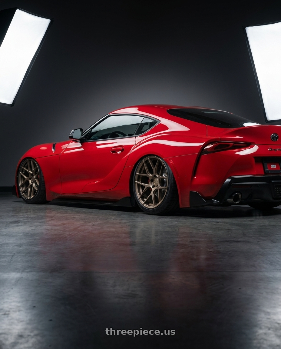 2023 Toyota GR Supra with Aodhan AFF2 5x112 19x8.5+35 Matte Bronze wheels rear three quarter view slight stretch tires