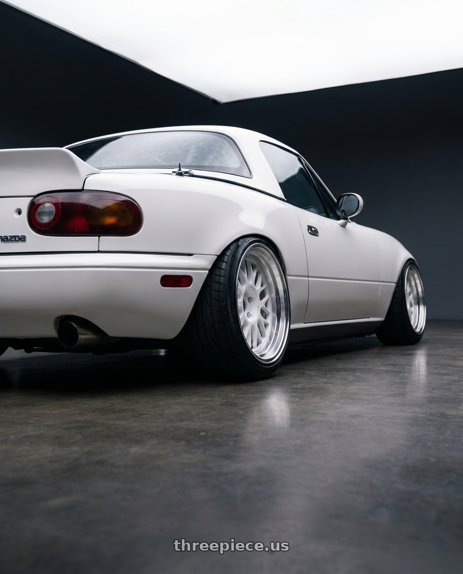 1993 Mazda Miata with Volk Racing 21A 5x112 18x10.5 +30 DASH WHITE/ DC wheels rear three quarter view extreme stretch tires