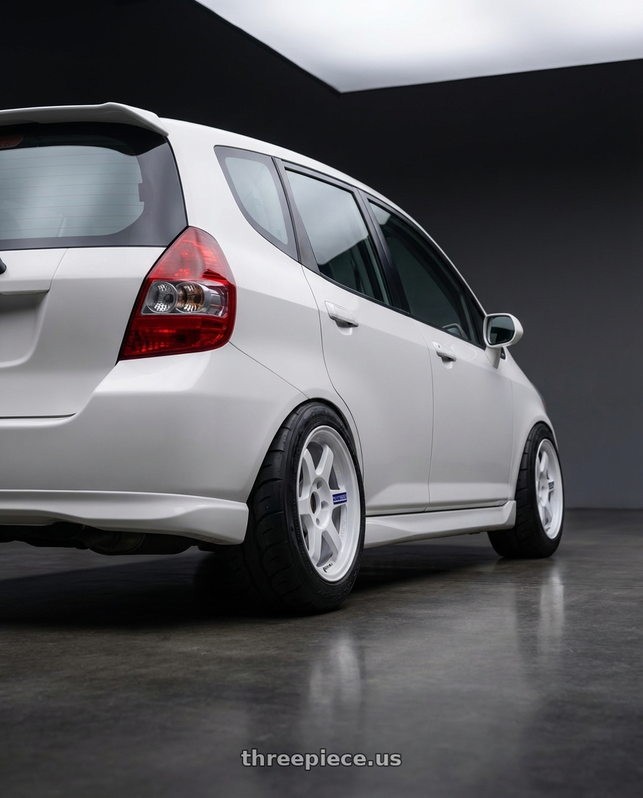 2007 Honda fit  with Volk Racing TE37 Gravel 5x114.3 15x7.0+35 White wheels rear three quarter view meaty tires