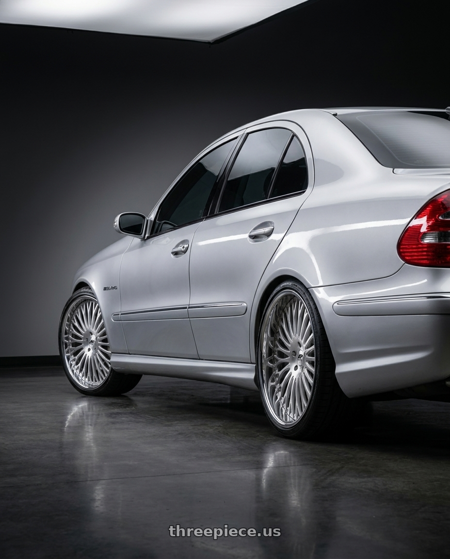 2011 benz e55  with Amani Napoliano 5x112/5x114.3 22x9 +32 Brush Center Chrome Lip wheels rear three quarter view square tires