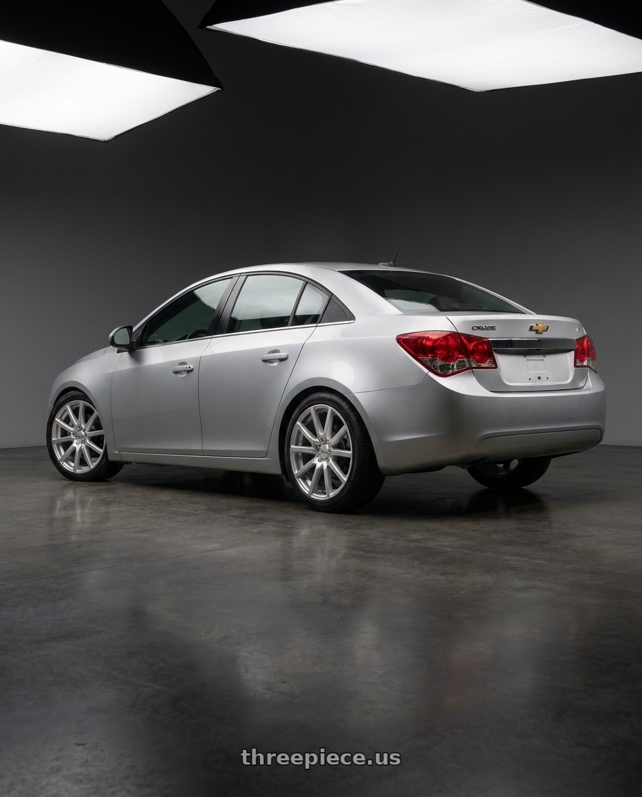 2015 Chevrolet Cruze with V�xx Este 5x98/5x105 16x7+40 Bright Silver wheels rear three quarter view square tires