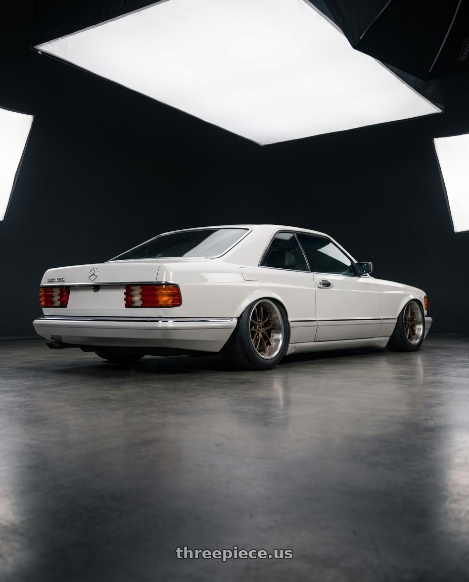 1987 Mercedes-Benz 560 SEC 5 with ARC AR5 5x115 18x8.5  +35 Bronze wheels rear three quarter view excessive tires