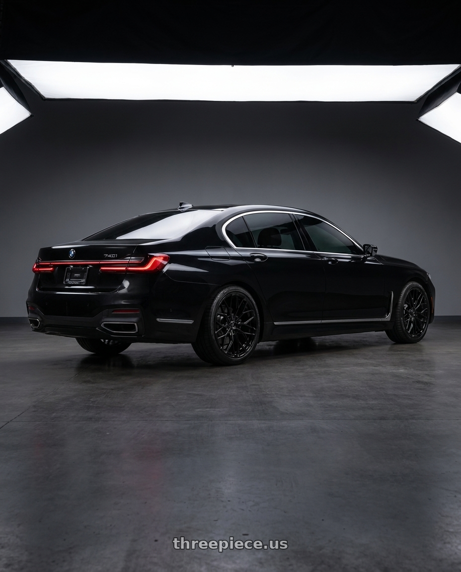 2021 BMW 740 i with DOLCE PERFORMANCE MAGARI 5x112 19x8.5 +28 Gloss Black wheels rear three quarter view square tires