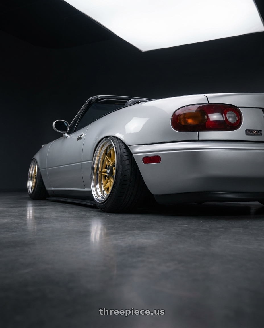 1993 Mazda Miata with WORK Equip 03 4x100 15x13 -16 GOLD wheels rear three quarter view extreme stretch tires