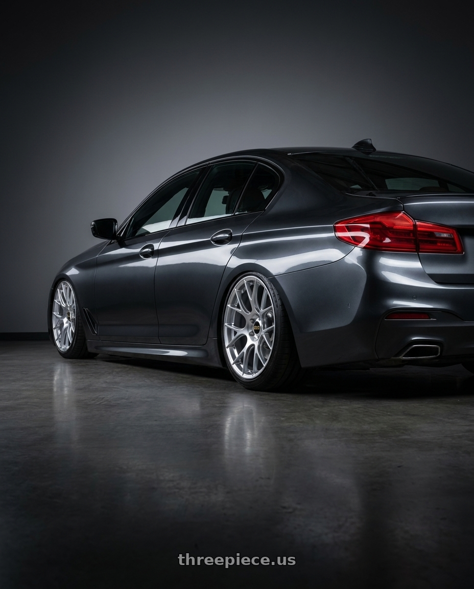 2020 Bmw 5 with BBS RE-V7 5x112 19x9.5 +25 Diamond Silver wheels rear three quarter view slight stretch tires