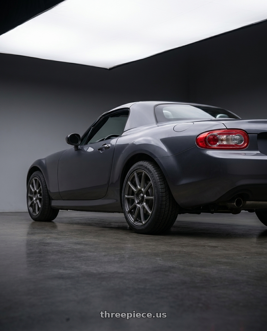 2014 Mazda Miata with Konig 41MG Runlite 5x114.3 18x8 +45 Matte Grey wheels rear three quarter view square tires