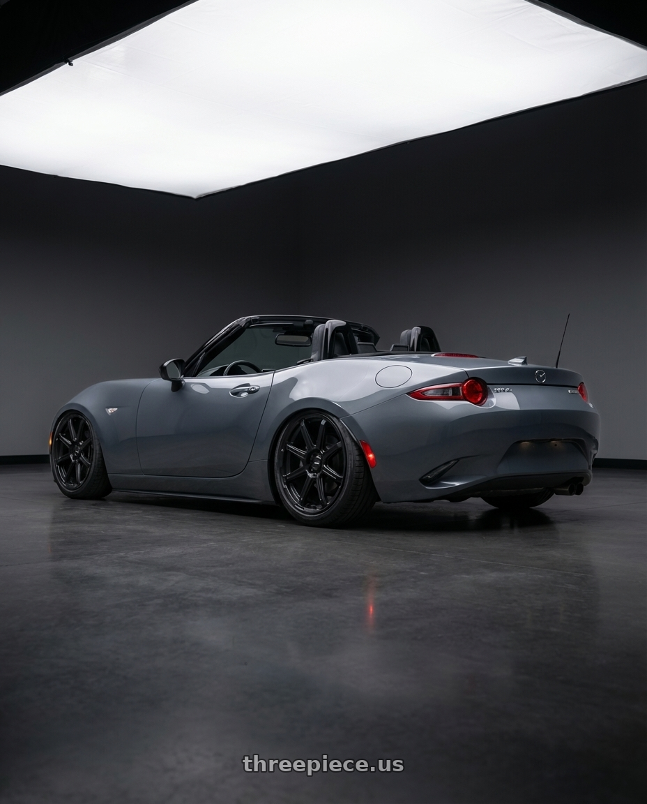 2021 Mazda mx-5 gt gray with Enkei Adventurer 5x100 18x8+35 Matte Black wheels rear three quarter view slight stretch tires