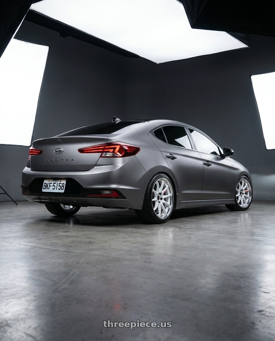 2020 Hyundai Elantra Sport MK6.5 with Work Zr10 2P 5x108 18x10.0 +45 Azure White wheels rear three quarter view square tires