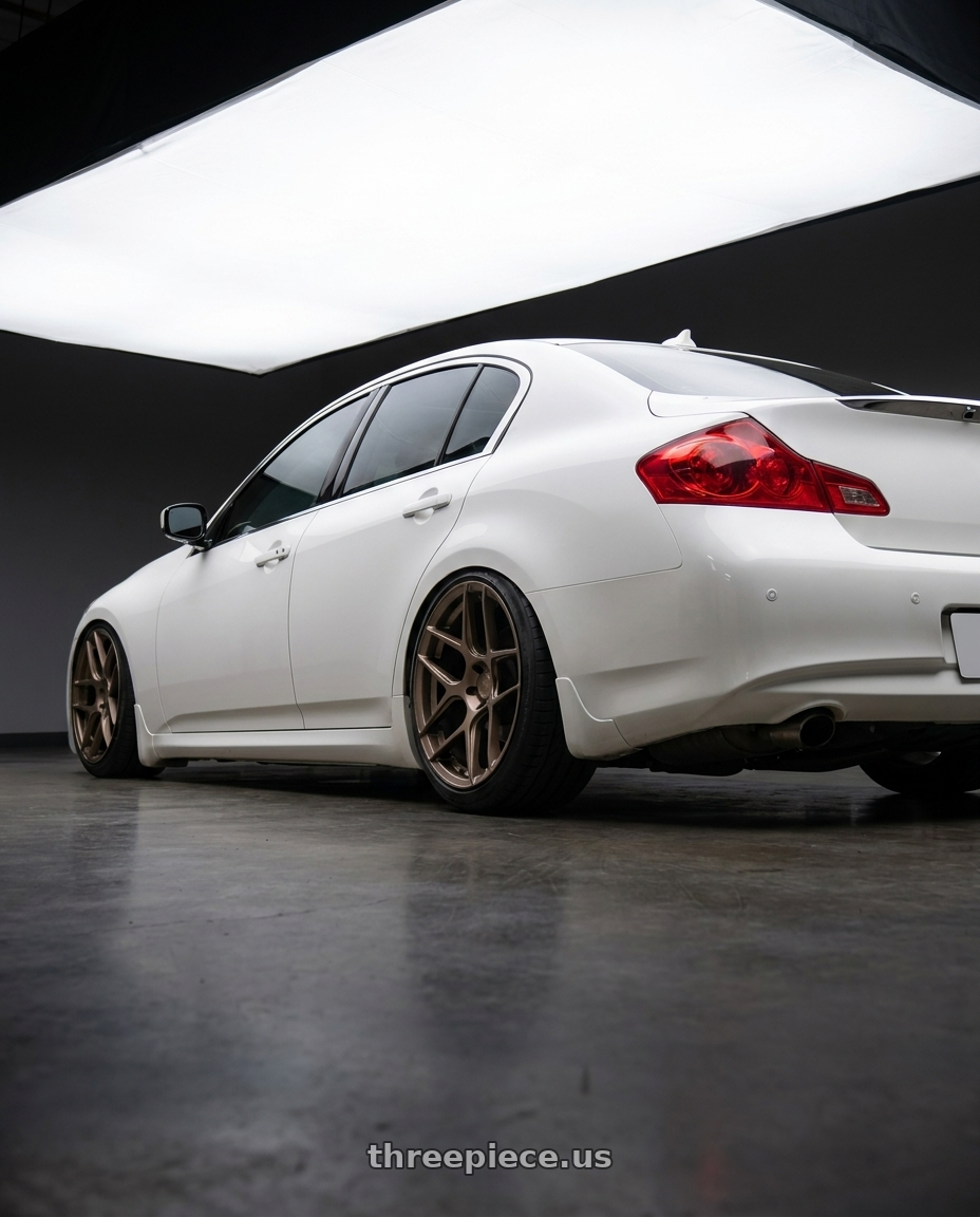2012 Infiniti G37 with Aodhan AFF2 5x114.3 19x9.5+35 Matte Bronze wheels rear three quarter view slight stretch tires