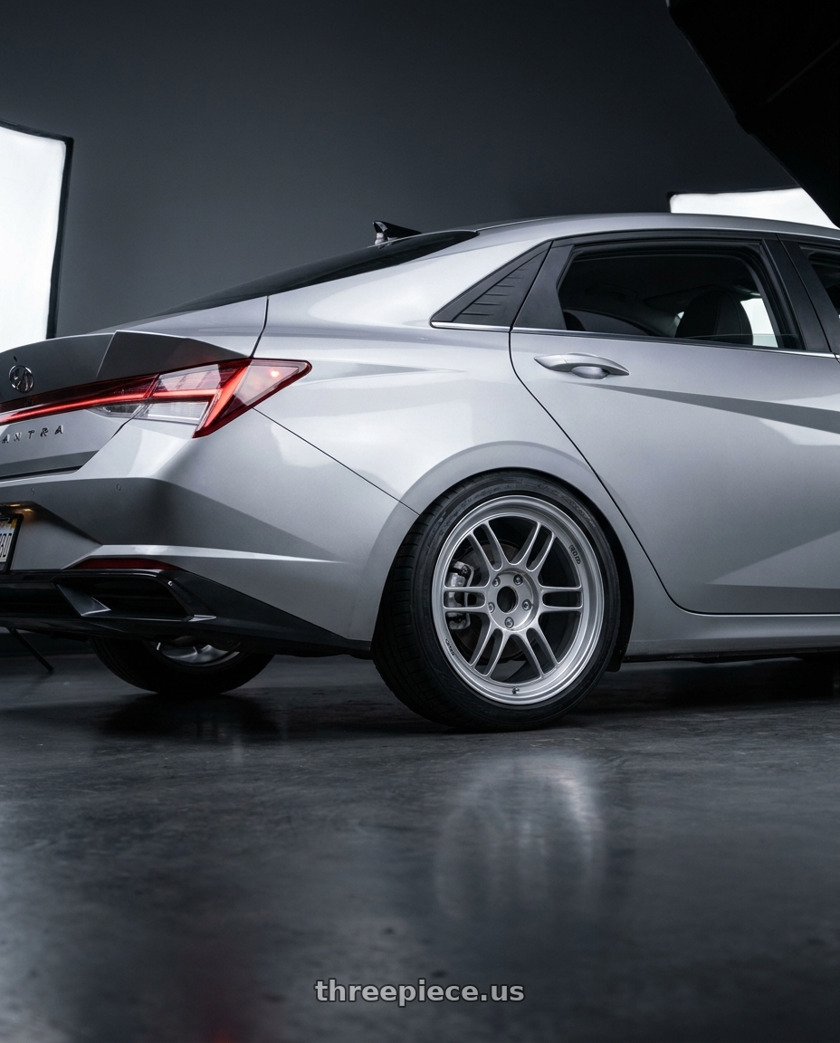 2021 Hyundai Elantra Limited with Enkei RPF1 5x114.3 18x9.5+45 Silver wheels rear three quarter view square tires
