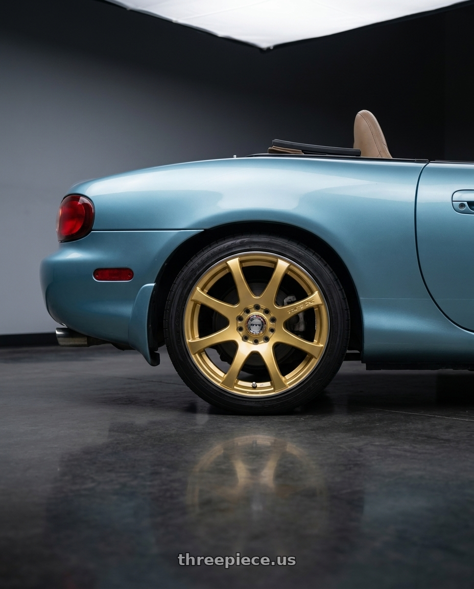 2002 Mazda Miata with RTX Ink 4x100 15x6.5 +40 Gold Machined wheels rear three quarter view square tires