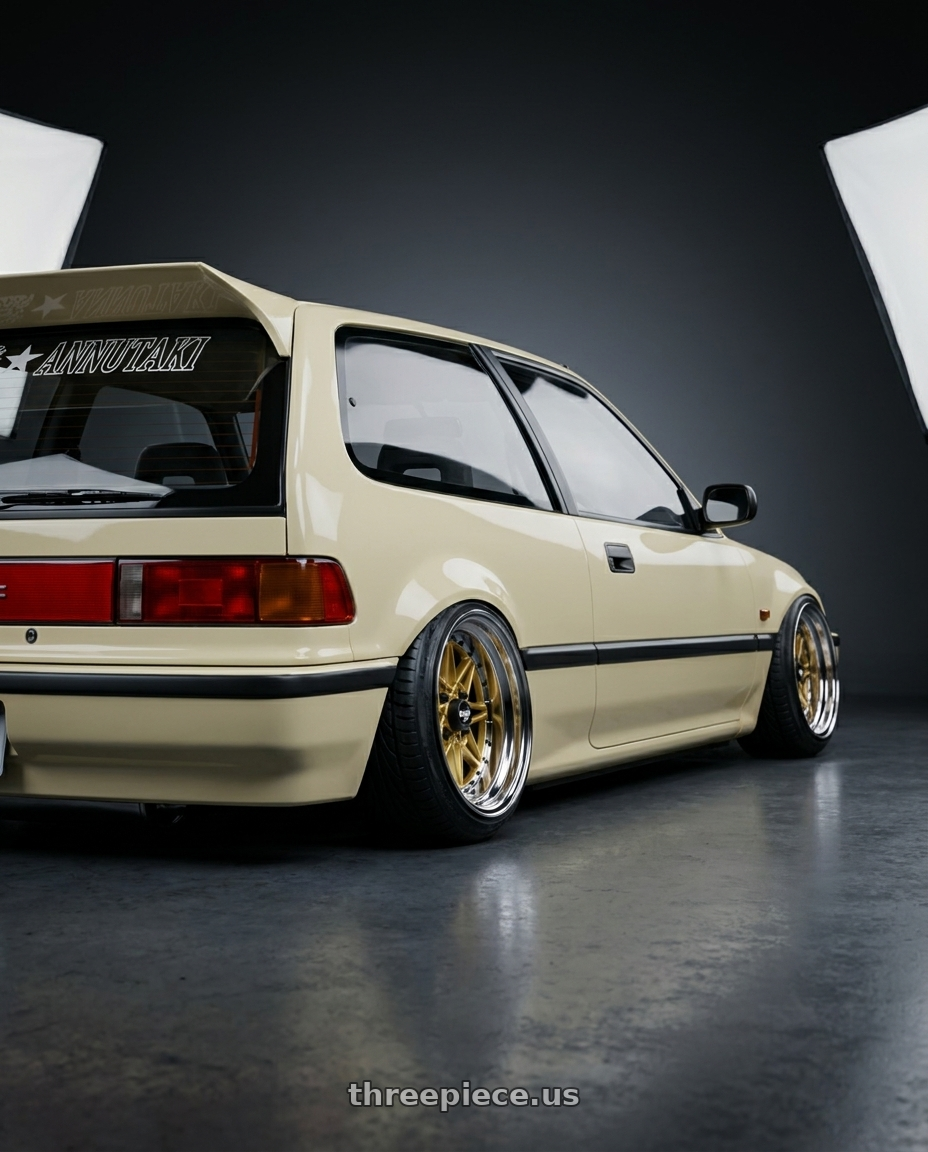 1991 Honda civic hatchback with WORK Equip 03 4x100 15x12 7 GOLD wheels rear three quarter view extreme stretch tires