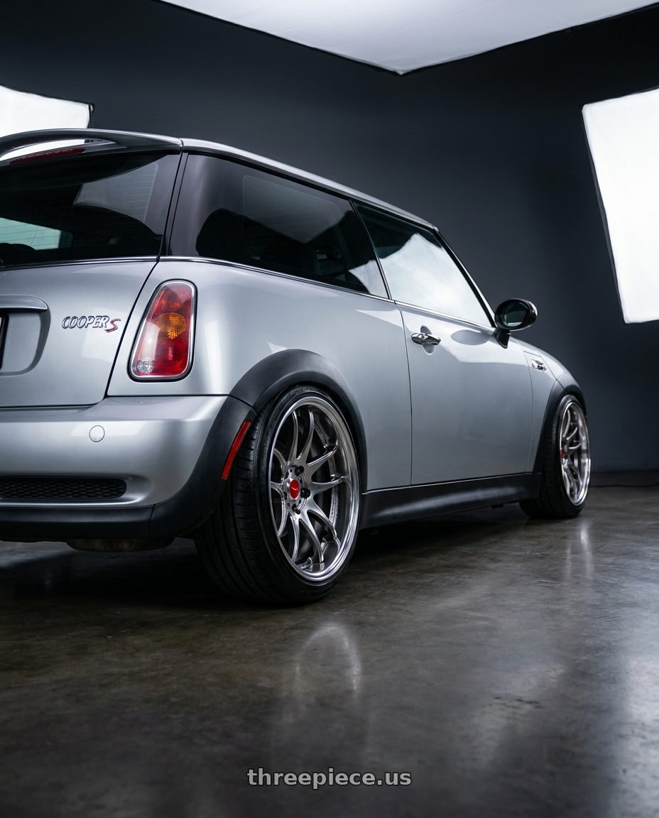 2004 mini coooer s with Work Cr 2P 4x100 17x8.0 +22 GT Silver wheels rear three quarter view slight stretch tires