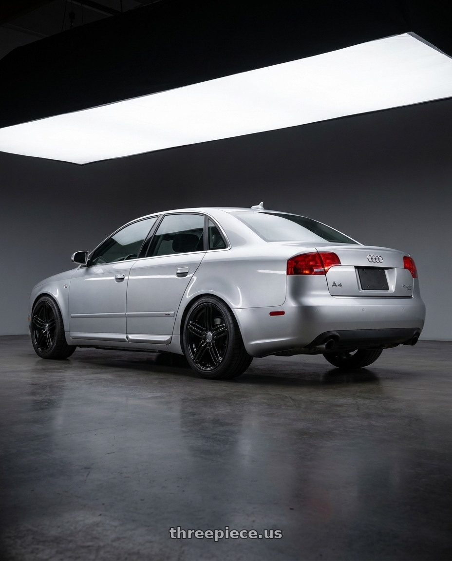 2008 Audi A4 Quattro with OE Wheels AU12 5x112 18x8+45 Gloss Black wheels rear three quarter view square tires