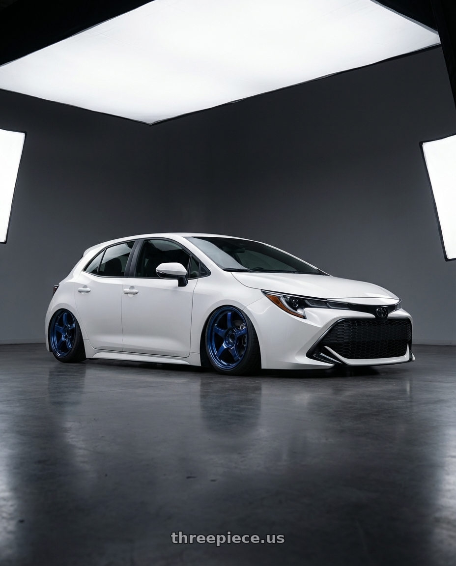 2023 Toyota Corolla Hatchback with Gram Lights 57CR 5x114.3 18x9.5+12 Eternal Blue Pearl wheels