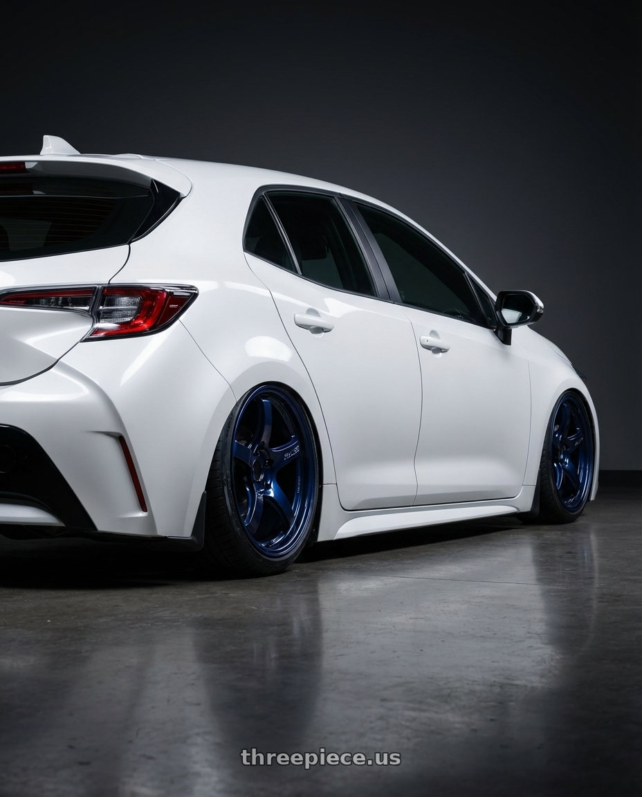 2023 Toyota Corolla Hatchback with Gram Lights 57CR 5x114.3 18x9.5+12 Eternal Blue Pearl wheels rear three quarter view slight stretch tires
