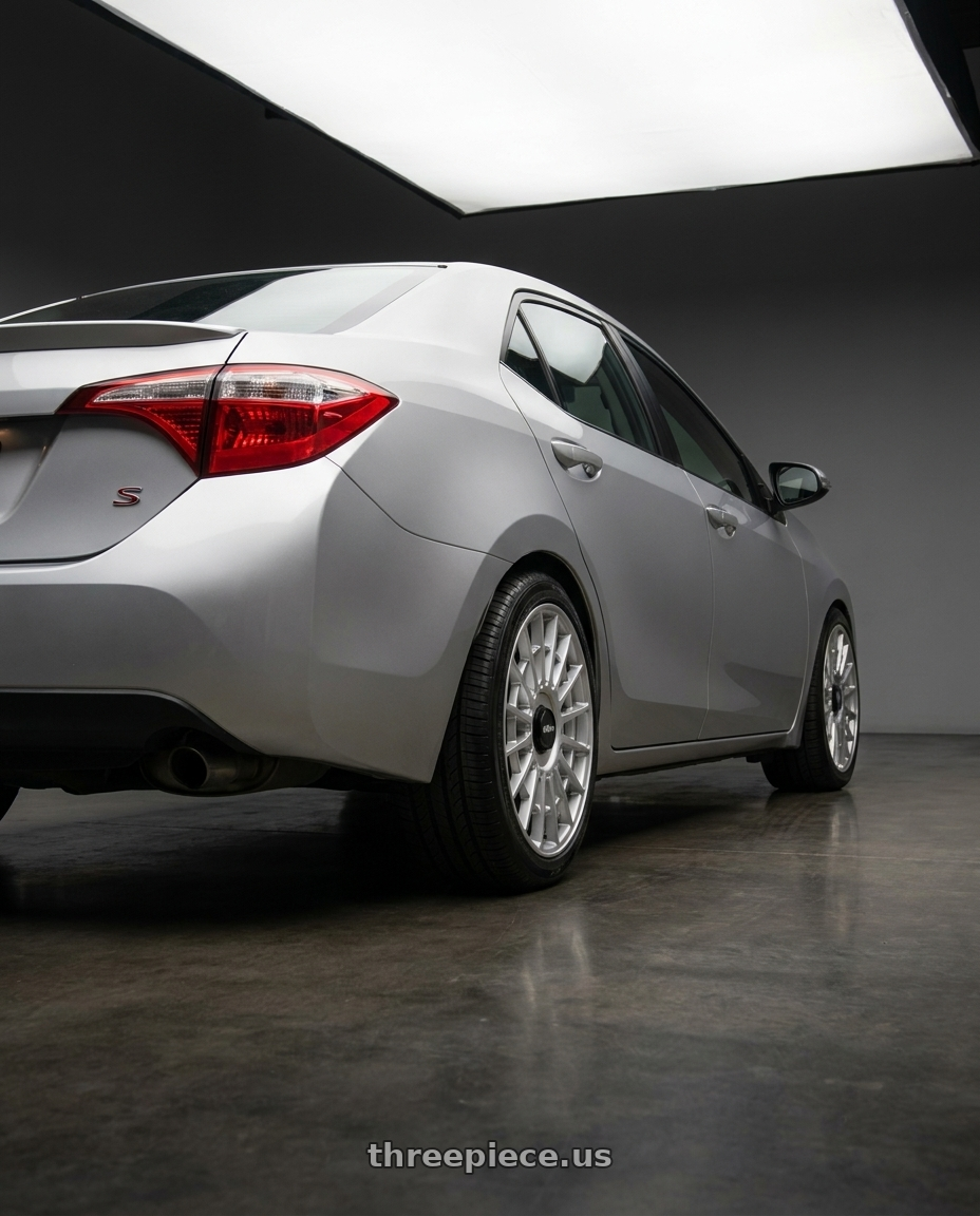 2015 Toyota Corolla S with Rotiform 1PC R134 FLG 5X120 18X8.5 +35 GLOSS SILVER wheels rear three quarter view square tires