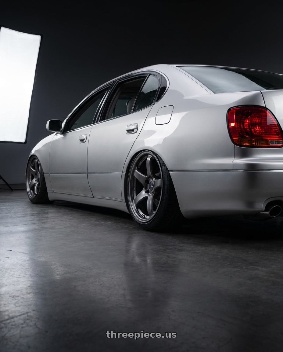 2001 Lexus gs300 with Enkei PF05 5x114.3 18x9.5+38 Dark Silver wheels rear three quarter view slight stretch tires