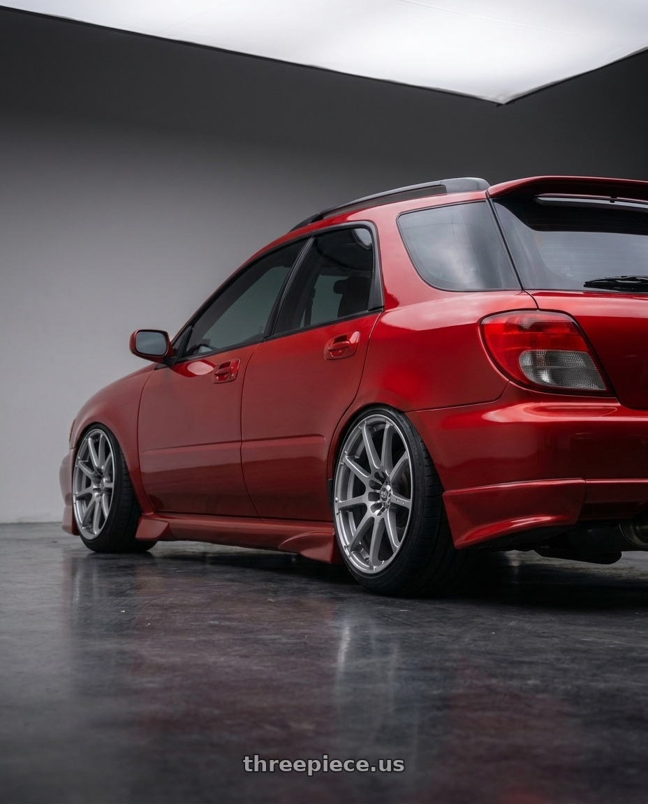 2002 subaru wrx wagon with Enkei EDR9 5x100/114.3 17x8+45 Silver wheels rear three quarter view slight stretch tires