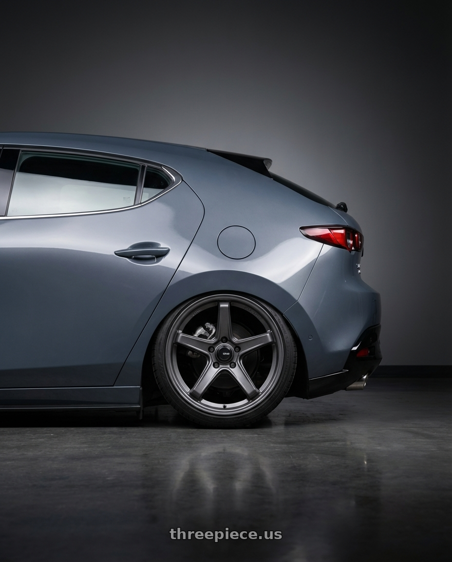 2023 Mazda Mazda3 Turbo with Konig Neoform 5X114.3 18x9.5+25 Matte Grey wheels rear three quarter view slight stretch tires