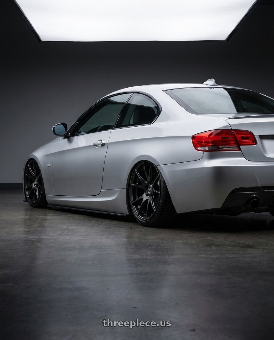 2012 BMW 3 Series E92 with Forgestar CF5V 5x120 19x9 +38 Satin Black wheels rear three quarter view slight stretch tires