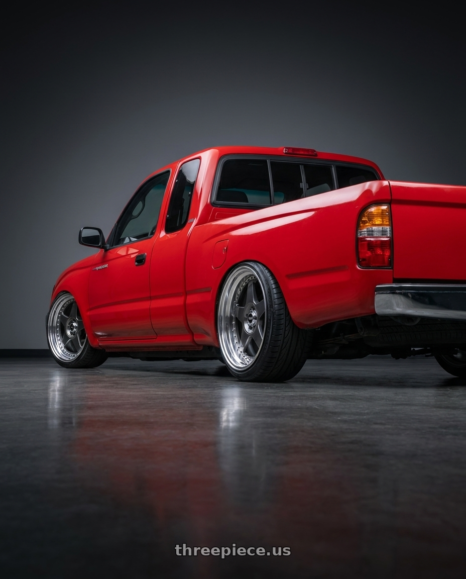 1996 toyota tacoma with SSR Professor SP6 5x100 18X7.5+12 HP Disk Prism Dark Gunmetal wheels rear three quarter view extreme stretch tires