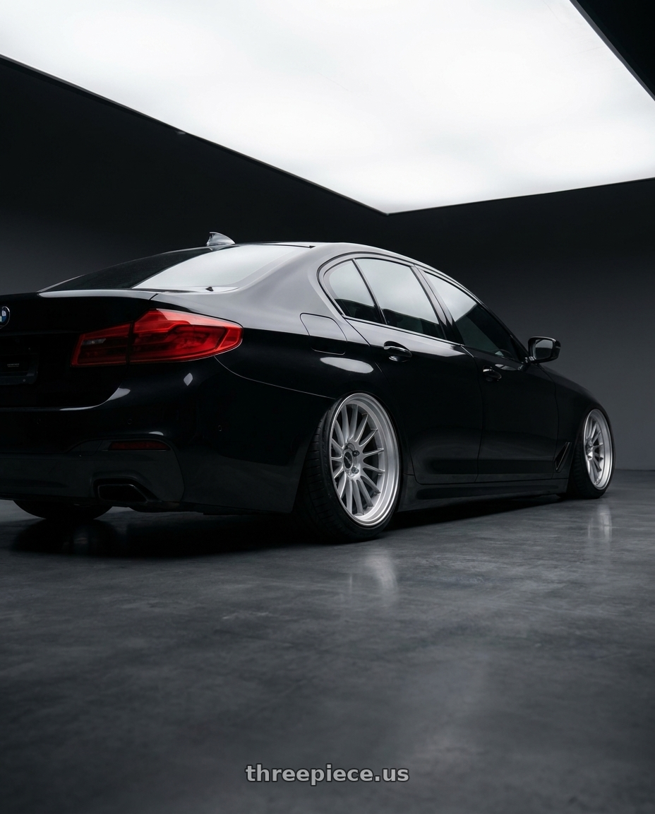 2018 BMW 5 series with Enkei RS05-RR 5x114.3 18x11+16 Sparkle Silver wheels rear three quarter view slight stretch tires