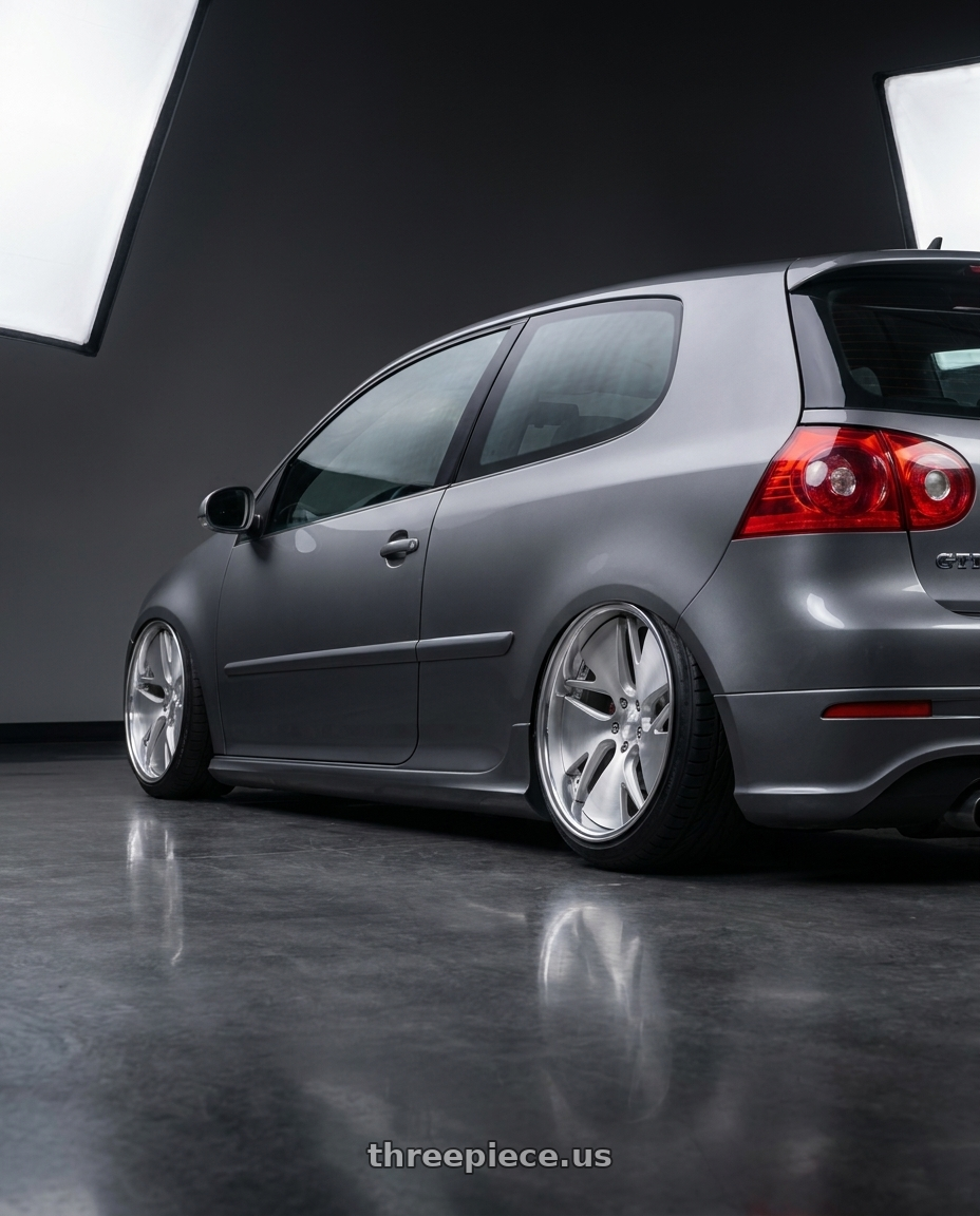 2009 VW GTI with Work Gnosis Cvd 5x114.3 19x9.5+45 W Disk Brush Silver Clear wheels rear three quarter view extreme stretch tires