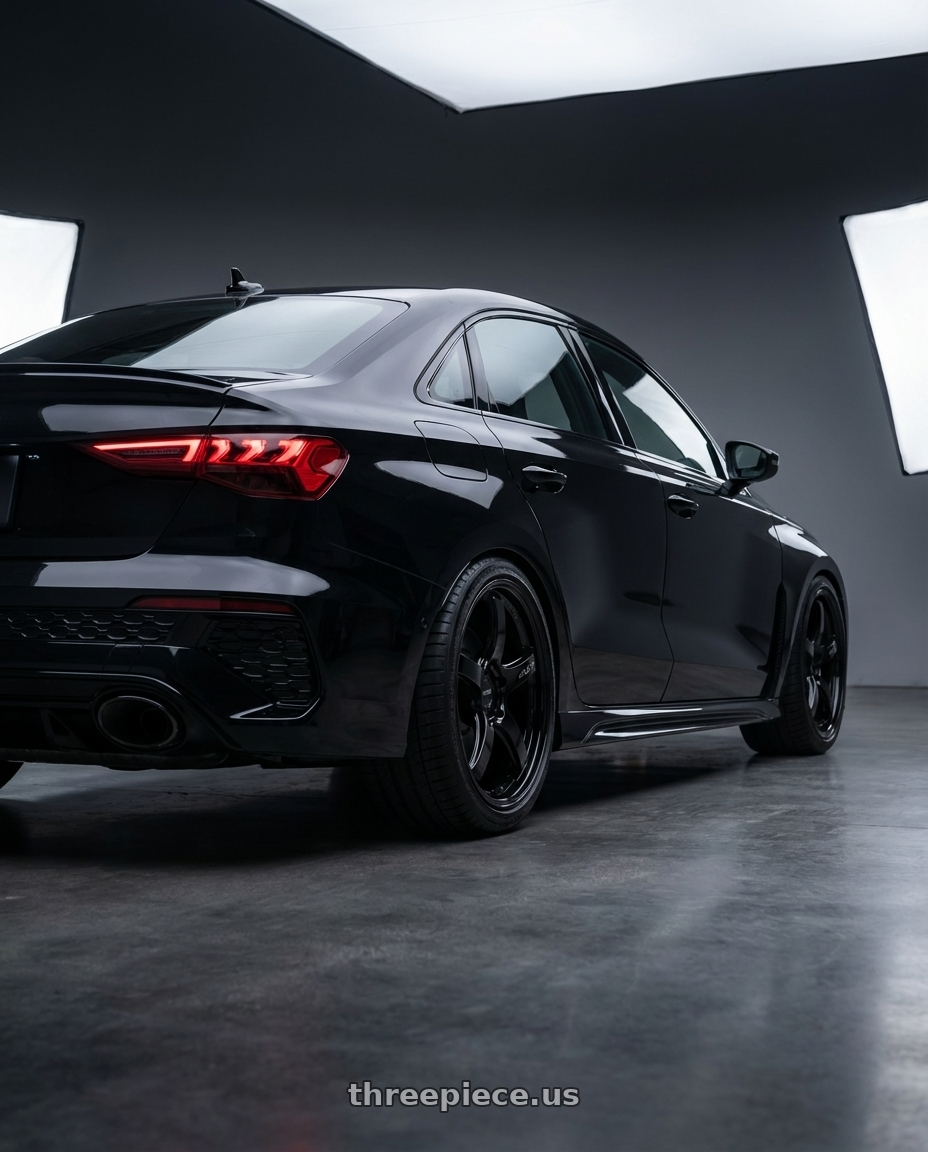 2022 Audi RS3 8Y with Gram Lights 57CR 5x112 19x10.5+22 Glossy Black wheels rear three quarter view square tires