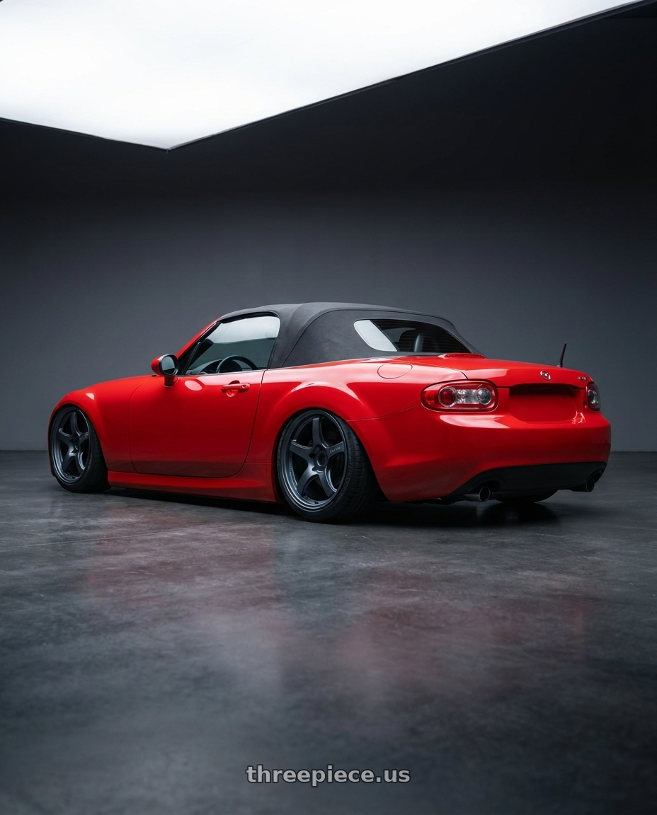 2012 Mazda MX-5 Miata NC with Gram Lights 57CR 5x114.3 17x9+22 Gunblue II wheels rear three quarter view slight stretch tires