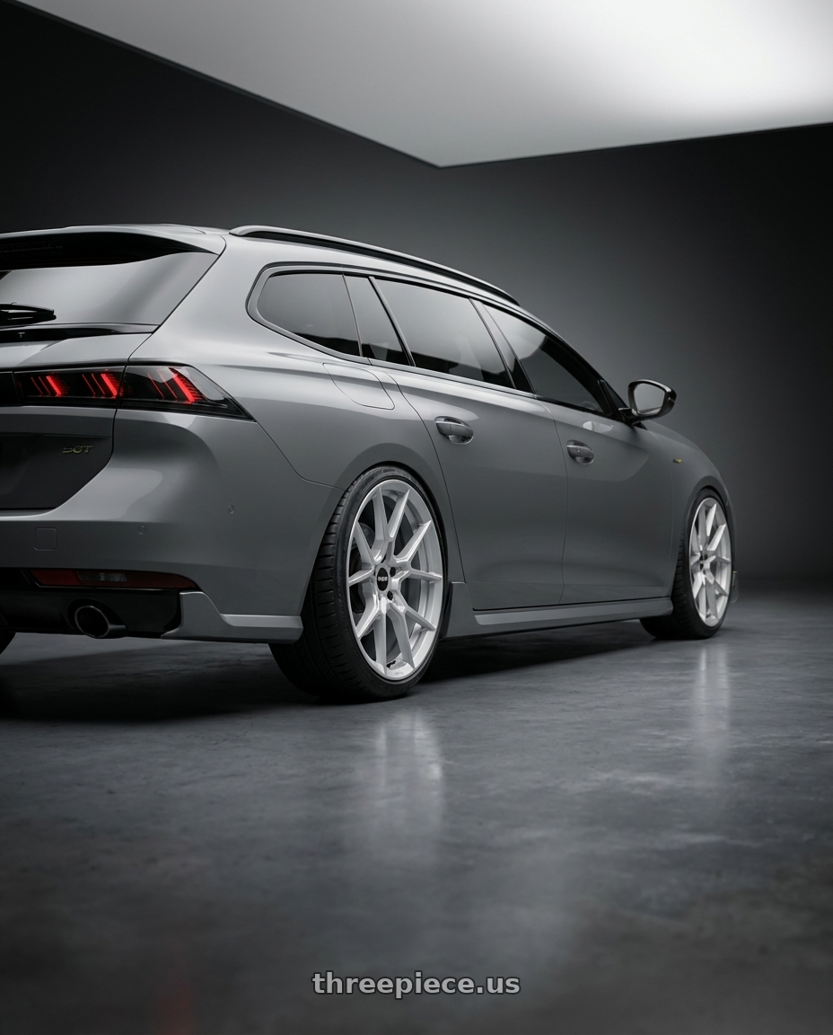 2022 Peugeot 508 SW GT with Rotiform RC199 KPR 5X112 20x9 +25 SILVER wheels rear three quarter view slight stretch tires
