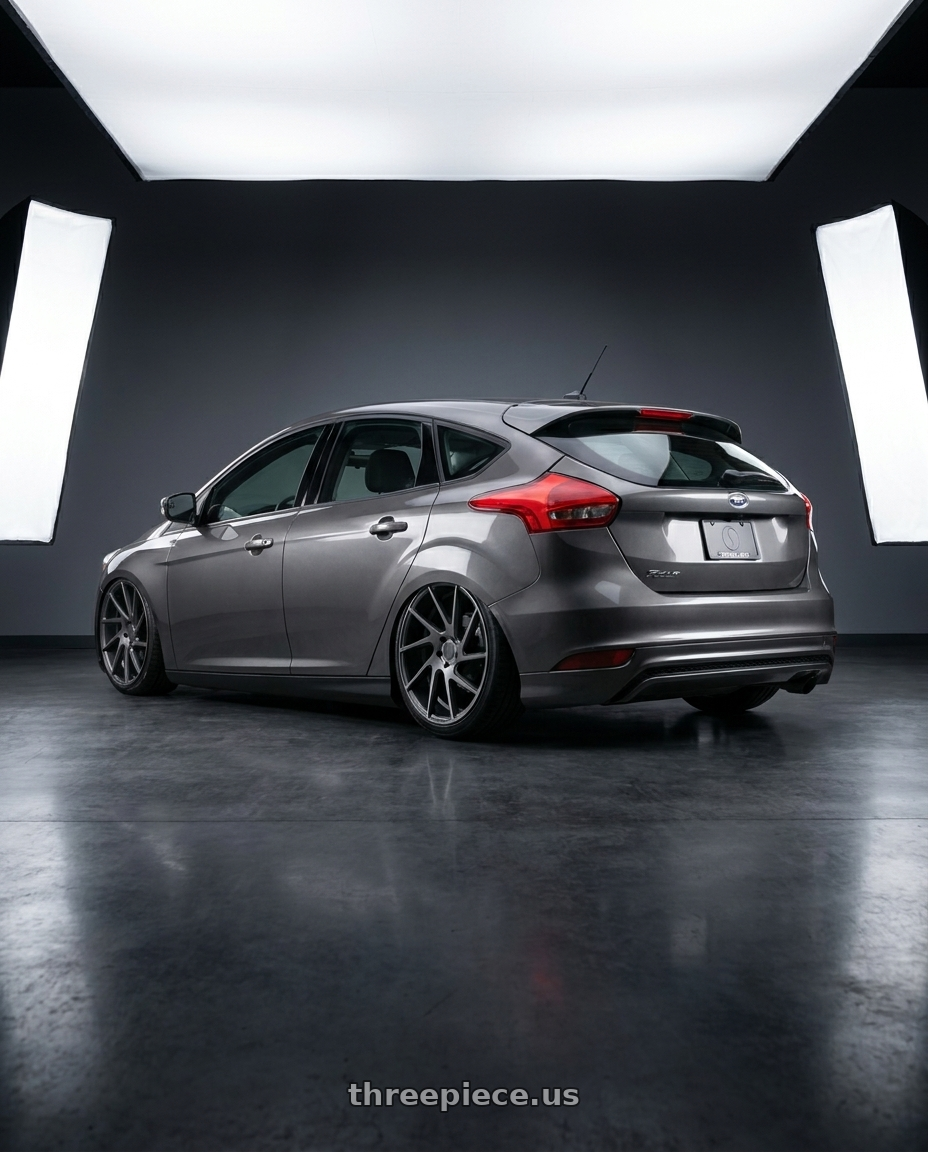 2017 Ford focus mk35 with Status JUGGERNAUT 6X114.3 20X9 +15 CARBON GRAPHITE wheels rear three quarter view slight stretch tires