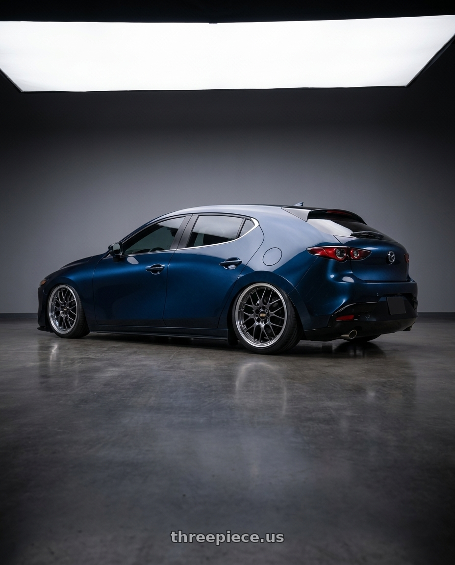 2025 Mazda 3 Deep Mica blue with Aero Kit with BBS RS-GT 5x114.3 19x8.0+45 Diamond Black wheels rear three quarter view slight stretch tires