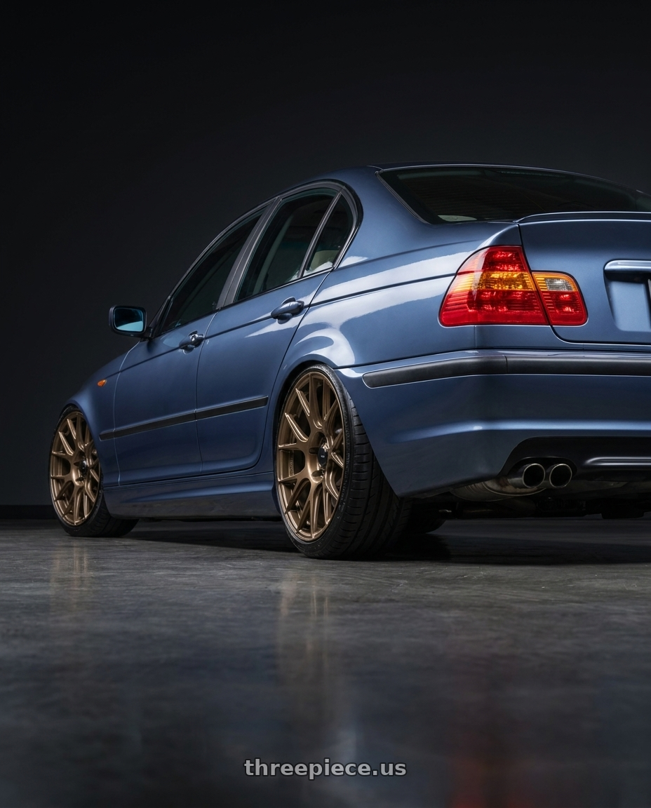2005 BMW 330I with Konig Ampliform 4x100 17x8+45 Gloss Bronze wheels rear three quarter view slight stretch tires