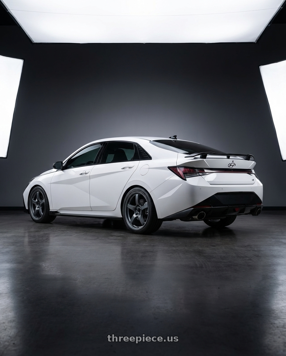 2024 Hyundai Elantra N with Gram Lights 57CR 5x114.3 19x9.5+25 Gunblue II wheels rear three quarter view square tires