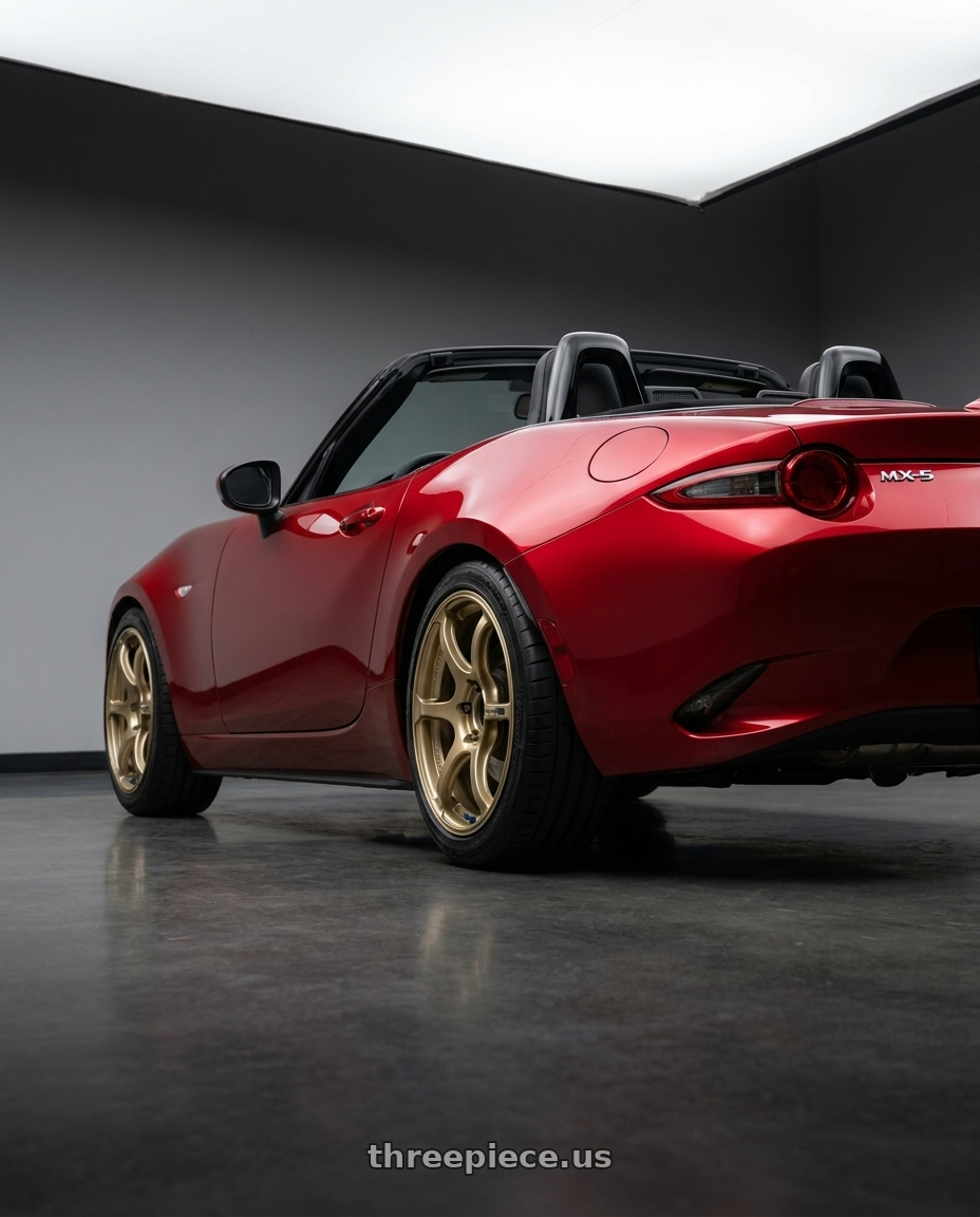 2024 Nd Mx5 with Advan RGIII 4x100 18x7.0+42 Gold wheels rear three quarter view square tires