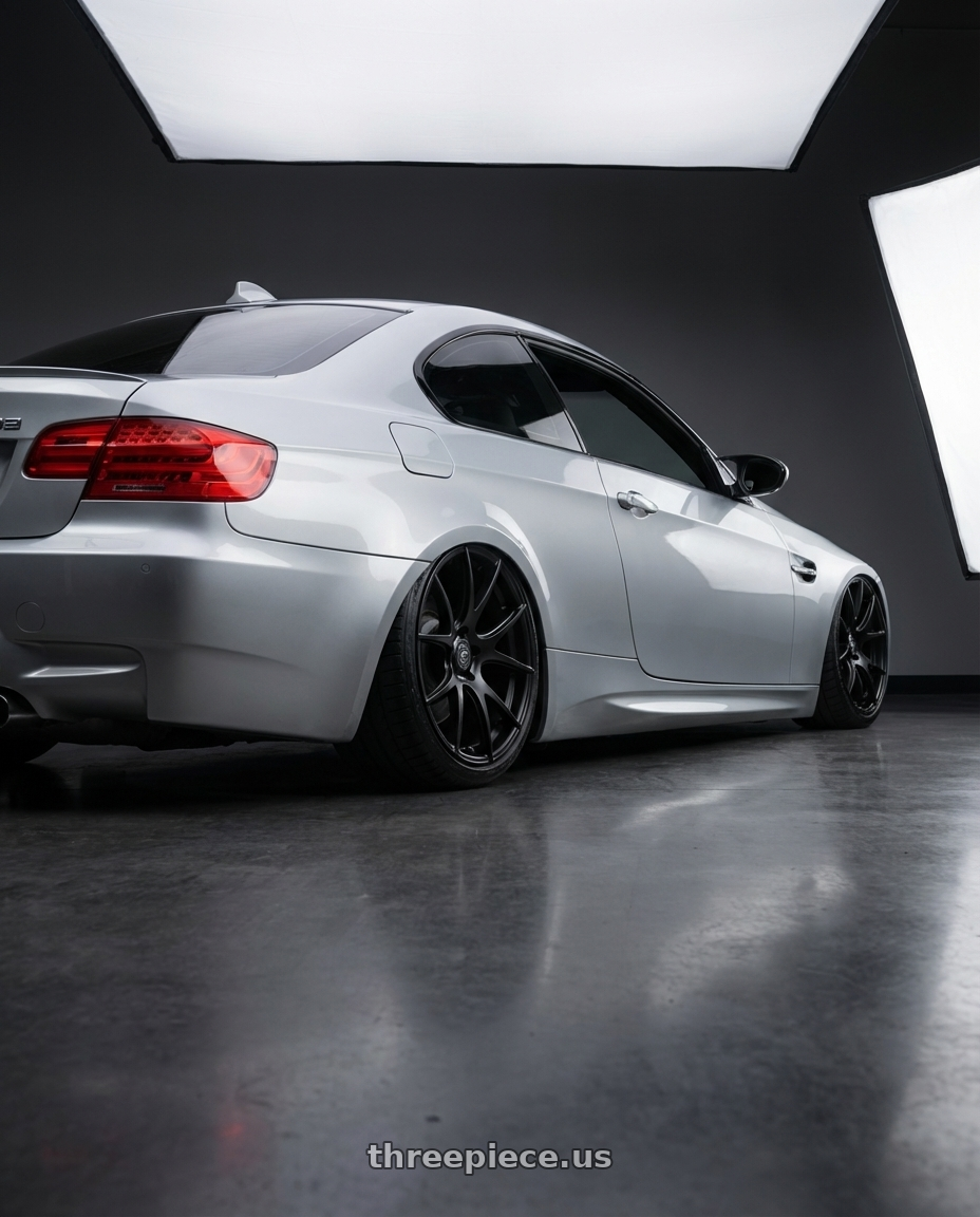2012 BMW 3 Series E92 with Forgestar CF5V 5x120 19x9 +38 Satin Black wheels rear three quarter view slight stretch tires