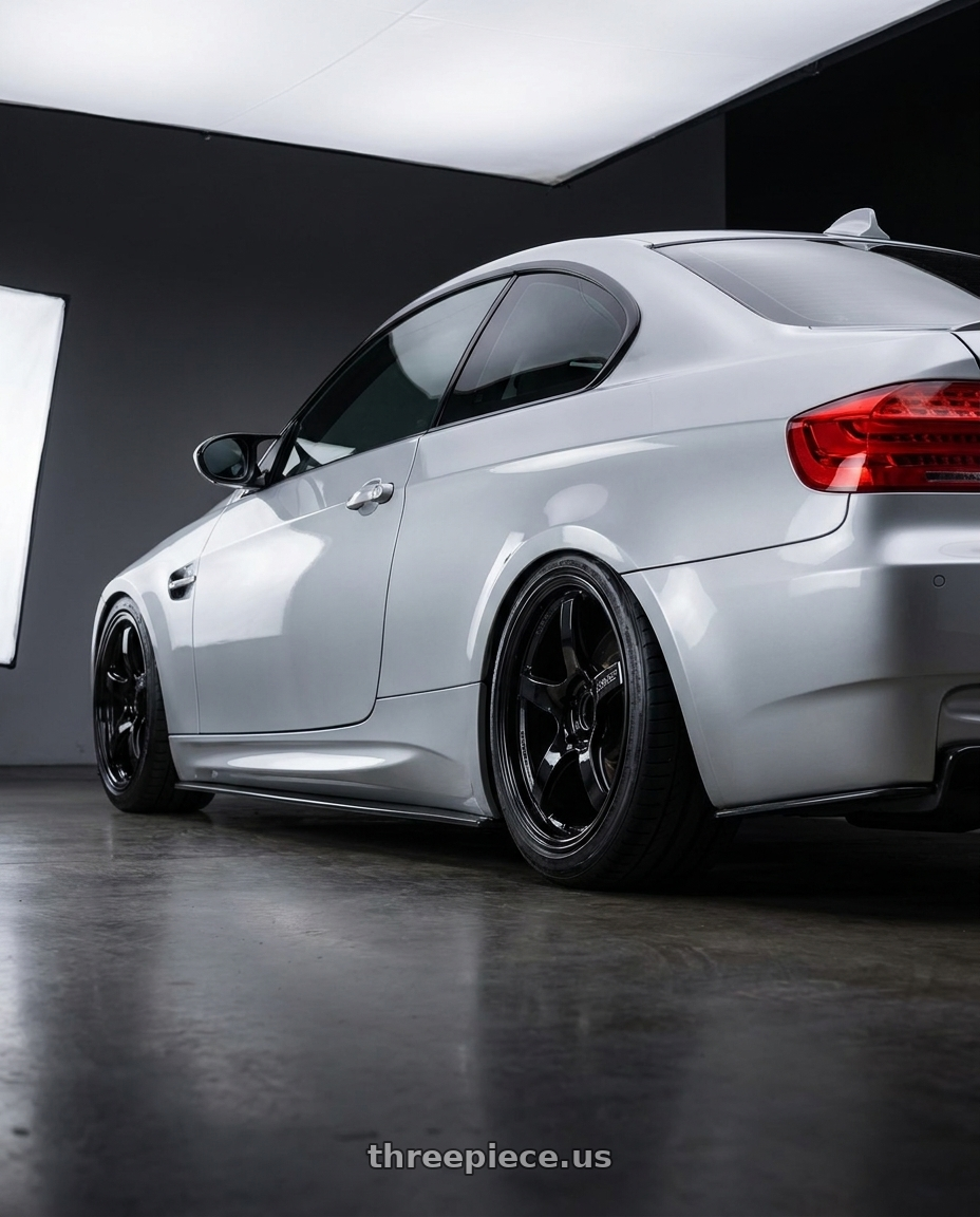 2012 BMW 3 Series E92 with Gram Lights 57CR 5x120 18x9.5+38 Glossy Black wheels rear three quarter view slight stretch tires