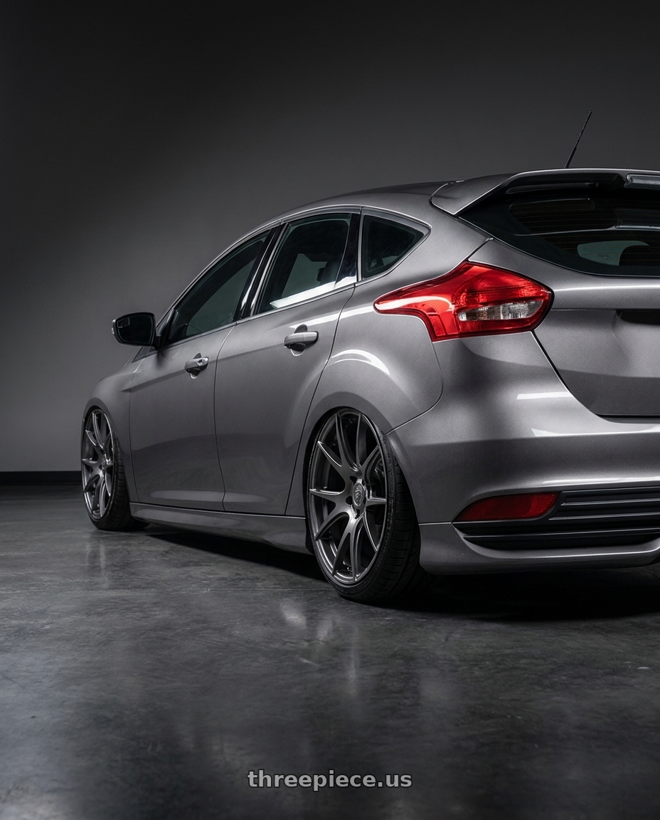 2017 Ford Focus Mk35 with Forgestar CF5V 6x114.3 19x11 +43 Gloss Anthracite wheels rear three quarter view slight stretch tires