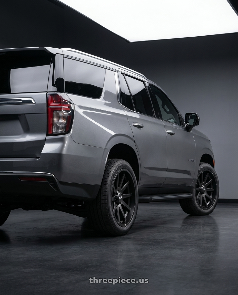 2021 Chevrolet Tahoe LS with Ion Type 143 6x139.7 20x9+18 Matte Black wheels rear three quarter view square tires