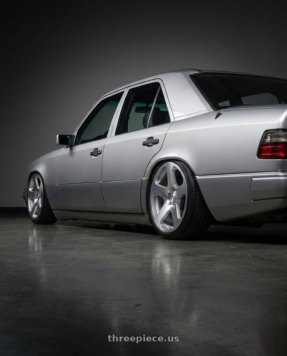 1995 Mercedes Benz E class with Rotiform RC200 NUE 5X120 20x10 +40 GLOSS SILVER W/ MACHINED FACE wheels rear three quarter view square tires