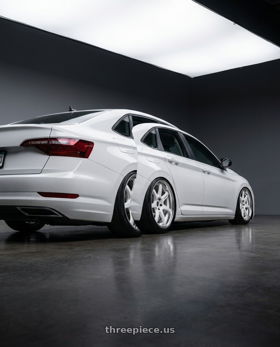 2023 volkwsagen jetta sport with Work T7r 2P 5x112 18x8.5 +45 WHITE wheels rear three quarter view slight stretch tires