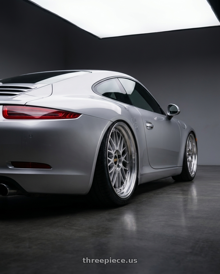 2015 Porsche 911 with BBS LM 5x120 21x10.0+38 Diamond Silver wheels rear three quarter view slight stretch tires