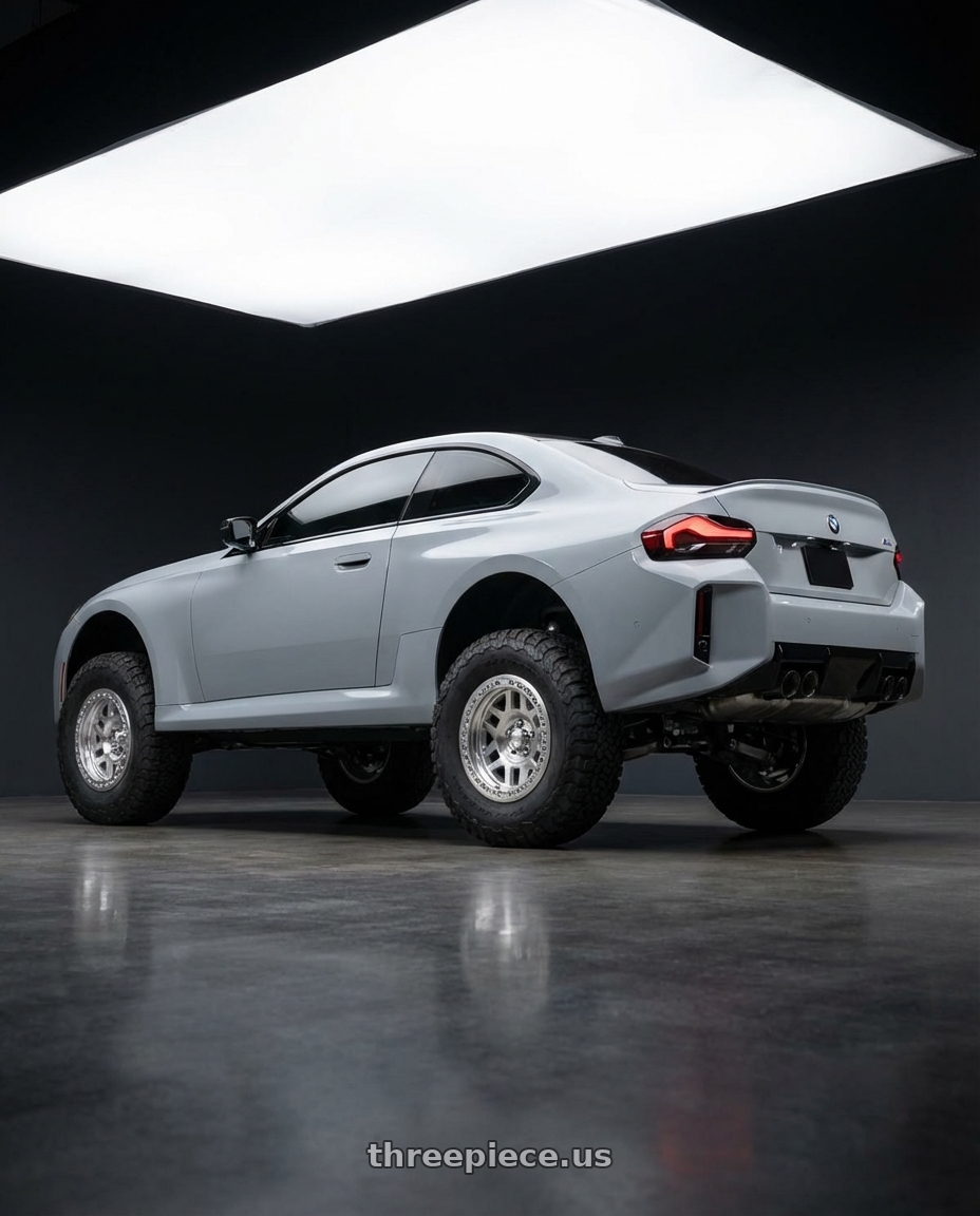 2026 BMW M2 with KMC KM229 MACHETE CRAWL BEADLOCK 5X127 17X9 -38 MACHINED wheels rear three quarter view meaty tires