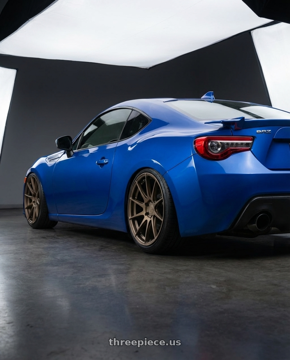 2017 Subaru BRZ with Aodhan AH09 5x100 18x9.5 +35 Matte Bronze wheels rear three quarter view slight stretch tires