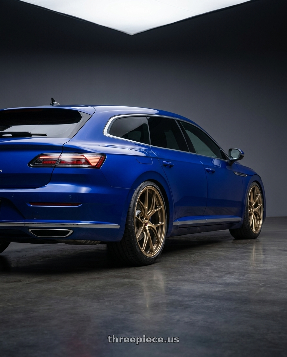 2023 vw Arteon shooting brake Lapiz Blue with BBS RI-D 5x112 20x9.5 +10 Diamond Gold wheels rear three quarter view slight stretch tires