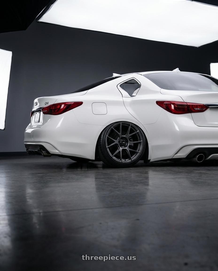 2020 Infiniti Q50 with Konig Ampliform 5x114.3 20x9.5+35 Dark Metallic Graphite wheels rear three quarter view slight stretch tires