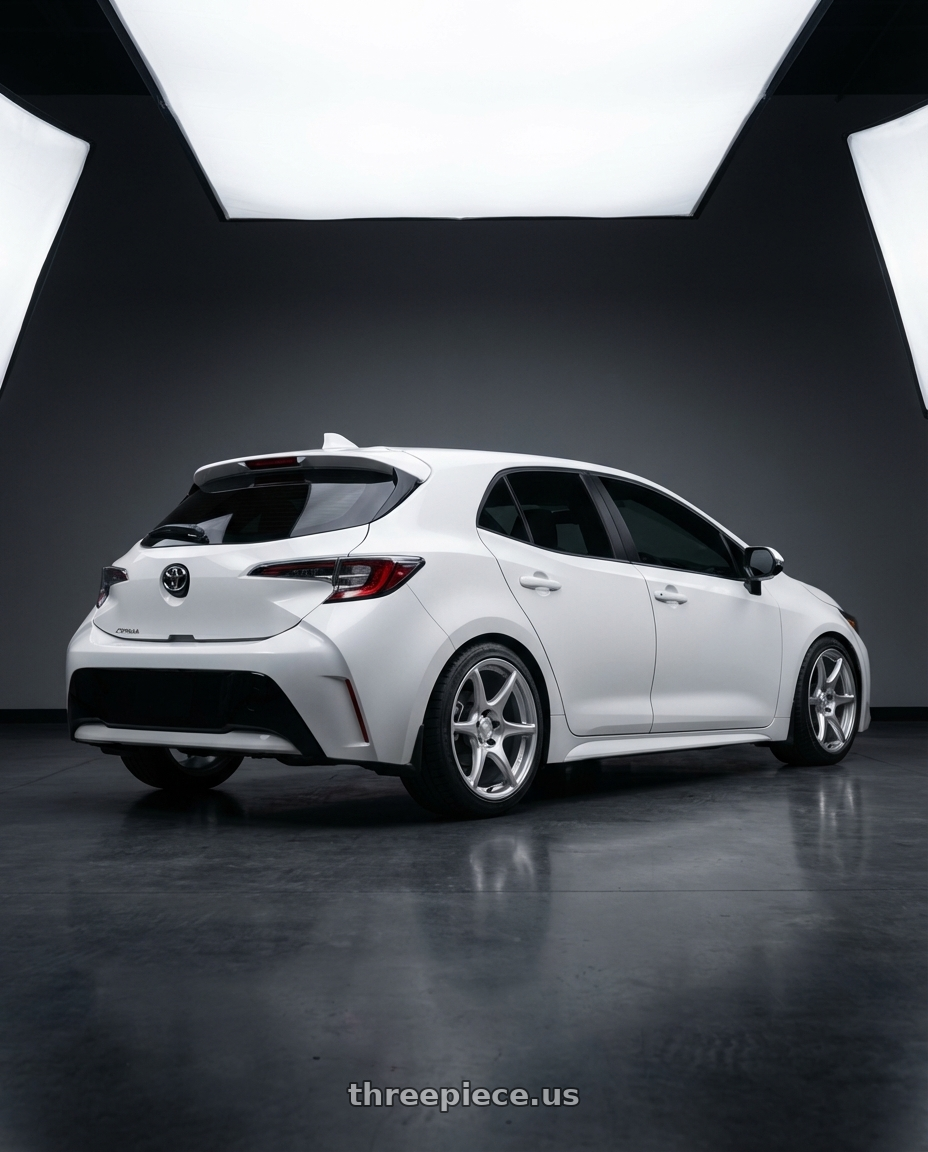2023 Toyota Corolla Hatchback with Kansei K11S Tandem 5x114.3 18x10.5 12 Hyper Silver wheels rear three quarter view square tires